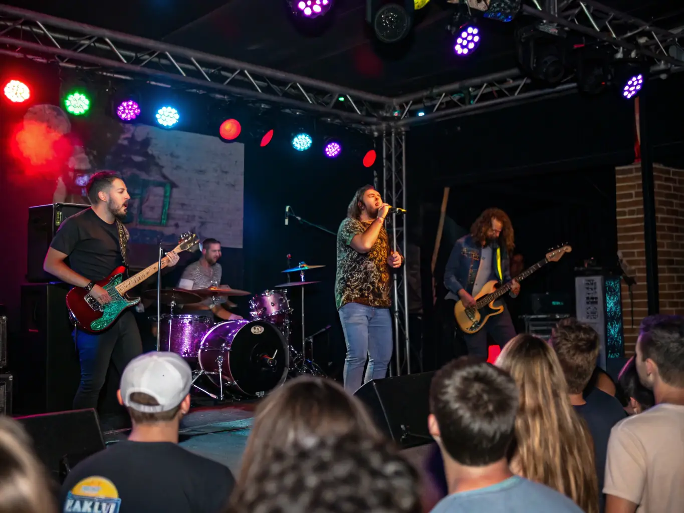 An image of a live music event organized by BANANAS RECORDS, capturing the energy and excitement of a performance and the audience's engagement.